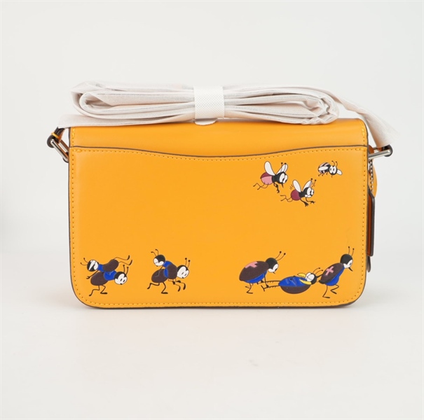 Túi Coach Disney màu vàng kèm chìa sz25 +