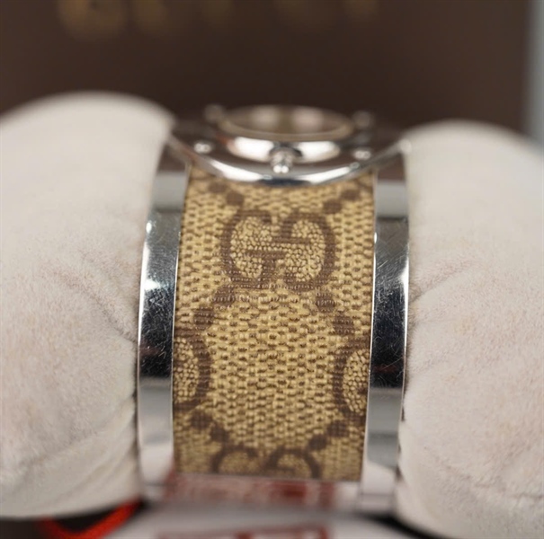 Đồng hồ GG mặt tròn dây nâu KG +