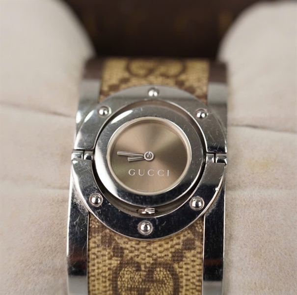 Đồng hồ GG mặt tròn dây nâu KG +