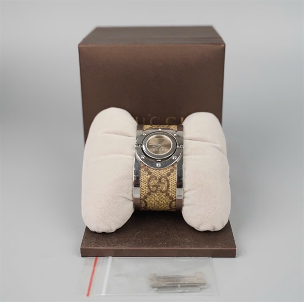 Đồng hồ GG mặt tròn dây nâu KG +