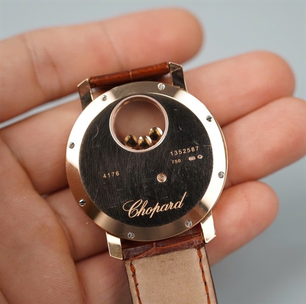 Đồng hồ Chopard dây nâu mặt tròn hình mặt trời (1352587) (HC) KG+