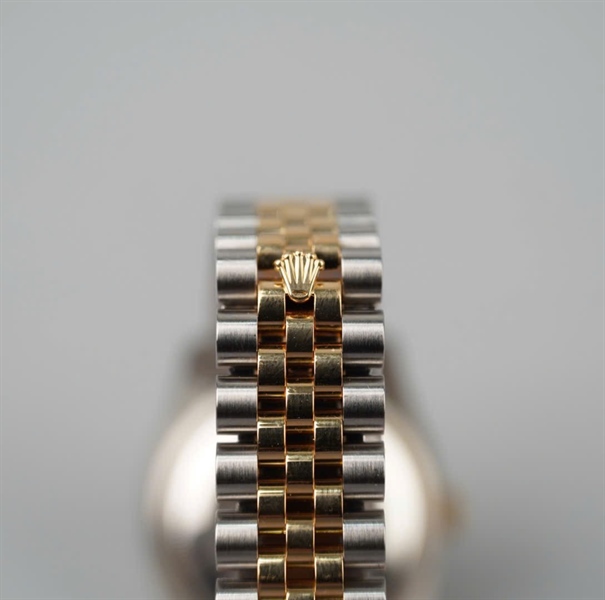 Đồng hồ Rolex mặt tròn viền vàng quai bạc (Q5602411) (HC) KG+