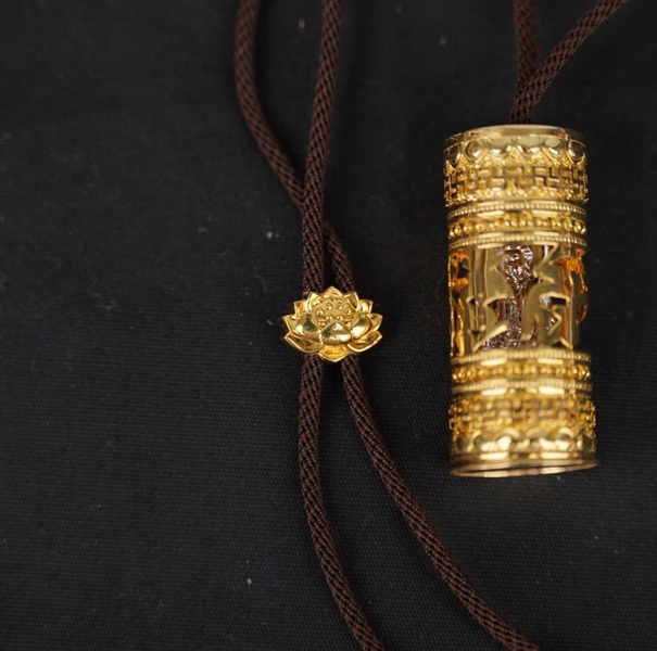 Dây chuyền Tara vàng 14K Ống Phật ngồi KG+