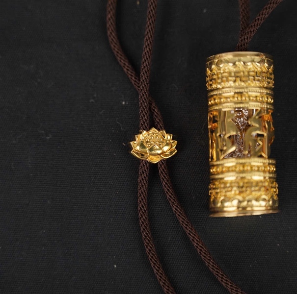 Dây chuyền Tara vàng 14K Ống Phật ngồi KG+