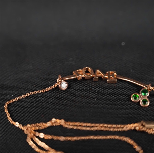 Dây Chuyền Tara 18K chữ Love đính 1v kim cương + gemstone xanh KG+