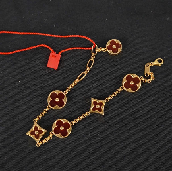 Vòng tay Van Cleef hoa đỏ KG+