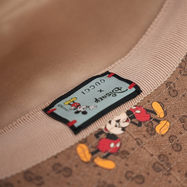 Nón GG nâu in hình cartoon szL rộng 30cm KG+