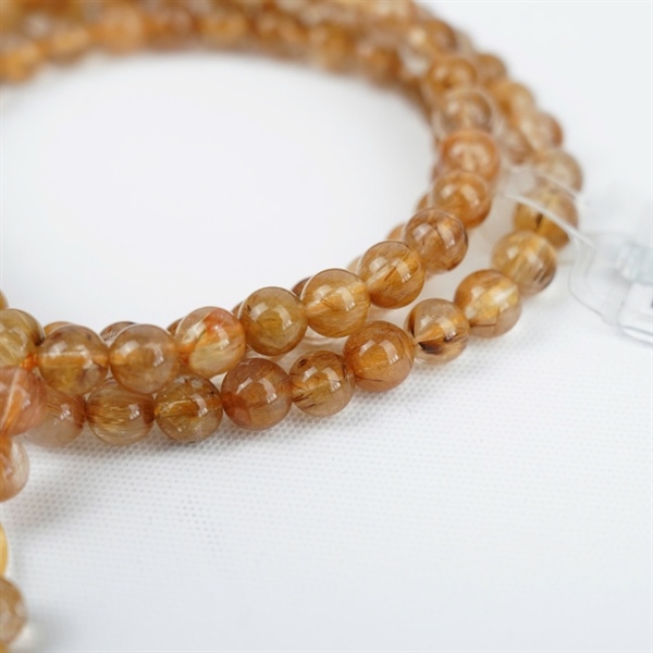 Chuỗi tóc nâu 108hạt 673896 kt 6.97-6.52ly KG+