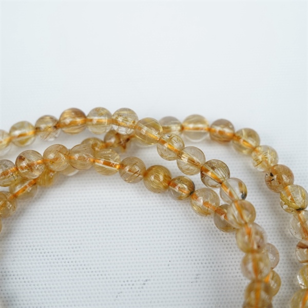 Chuỗi tóc vàng 118hạt 295976 kt6.53-4.39ly KG+