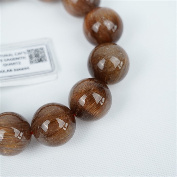 Vòng tay tóc nâu to 13hạt 566694 kt18.65-18ly KG+