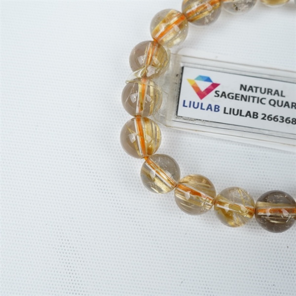 Vòng tay tóc vàng 20hạt 266368 kt10.03-9.50ly KG+