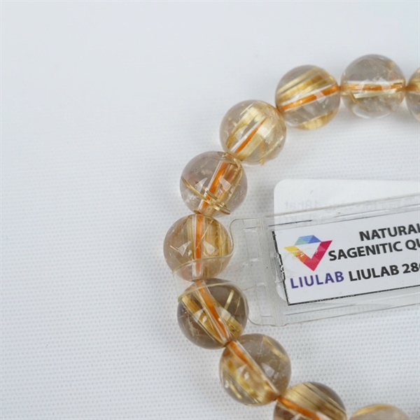 Vòng tay tóc vàng 18hạt 286488 kt 11.87-11.37ly KG+