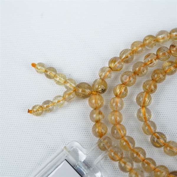 Chuỗi tóc vàng 118hạt 295976 kt6.53-4.39ly KG+