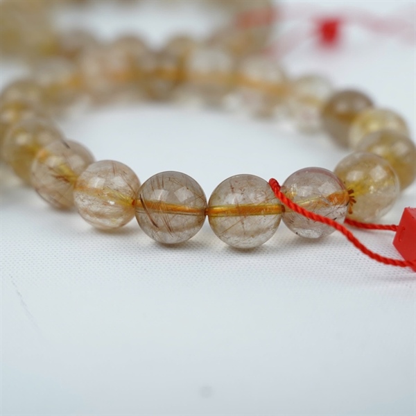 Vòng thạch anh tóc vàng ly11 +