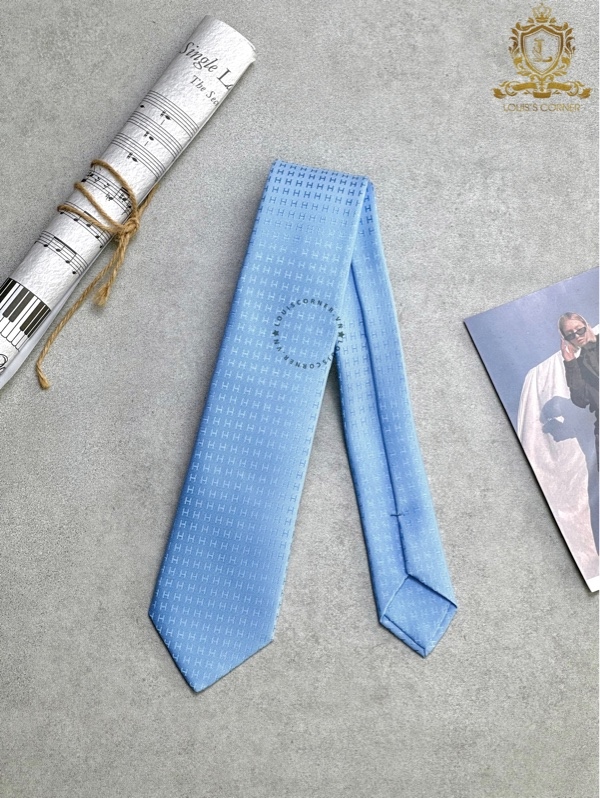 Cravate Hermes faconnee H bleu / ciel