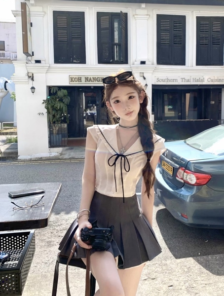 Áo nữ thô cổ sen nhọn nơ ngực