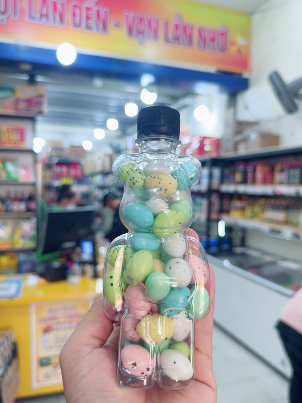 Chai kẹo socola trứng khủng long ( hình gấu )