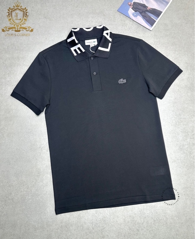 Polo Lacoste đen cổ chữ trắng