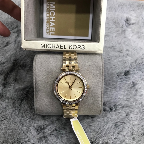 Đồng hồ MK vàng mặt tròn viền đính đá+