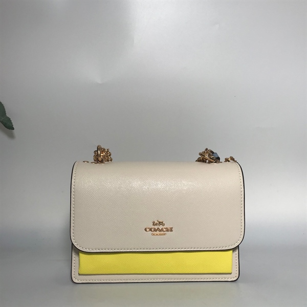 Túi Coach trắng vàng KG+