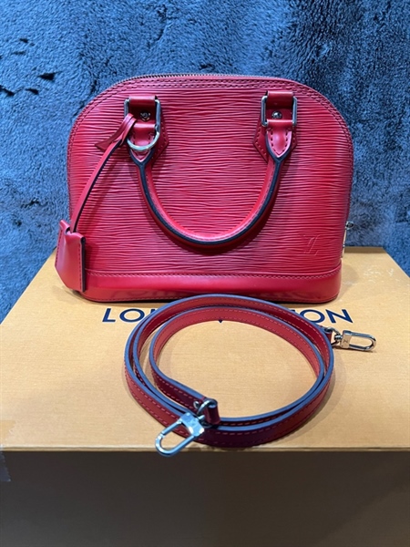 Túi LV Alma vân đỏ zip trắng KG+