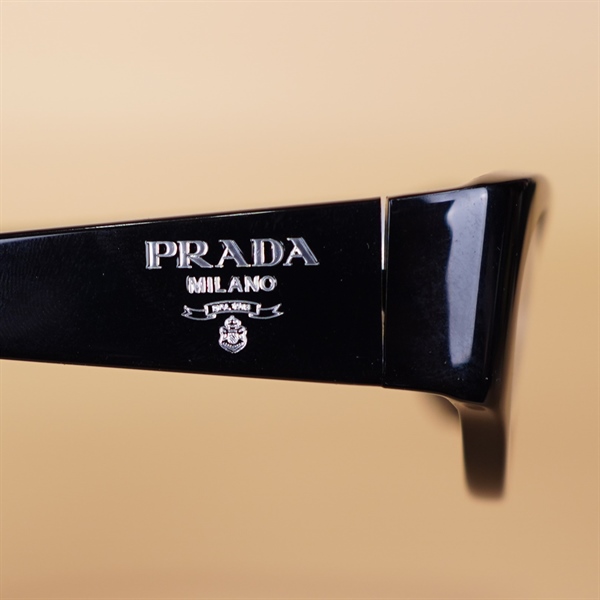 Kính Prada VPR06Z elip viền đen KG+