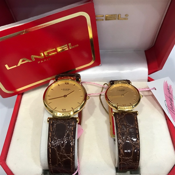 Đồng hồ Lancel cặp mặt vàng dây da nữ KG+