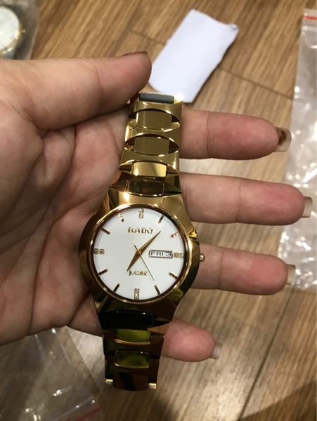 Đồng hồ nam Rado mặt tròn dây vàng đồng KG+