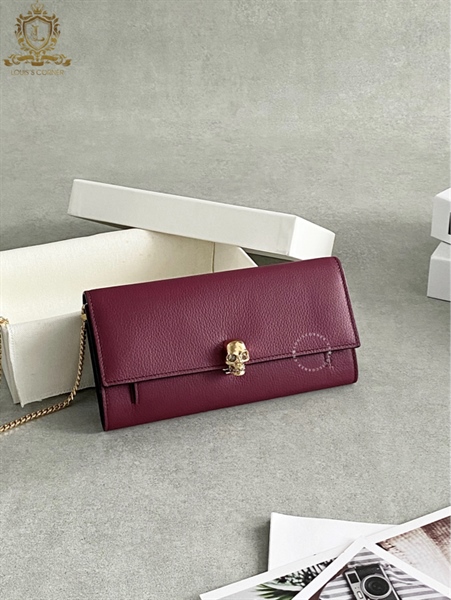 Túi MCQ nữ tím sần đầu lâu vàng