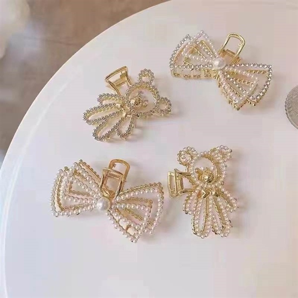 Kẹp càng cua sắt nơ đính ngọc